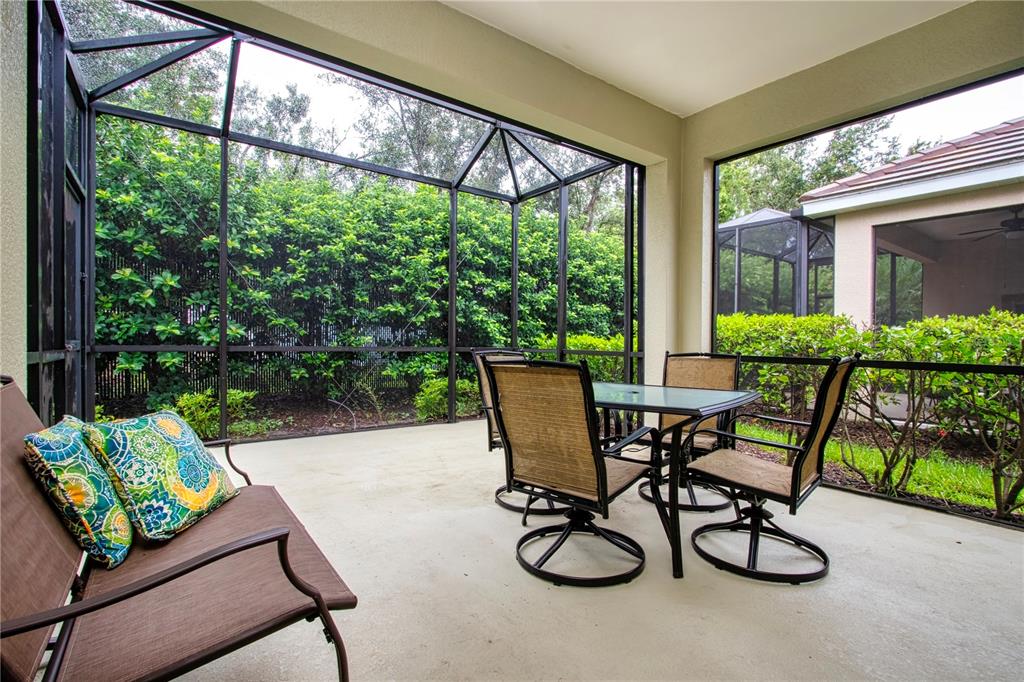 4920 Maymont Park Circle Bradenton, FL 34203 - Photo 58 of 59 a view of a patio with chairs and table in patio