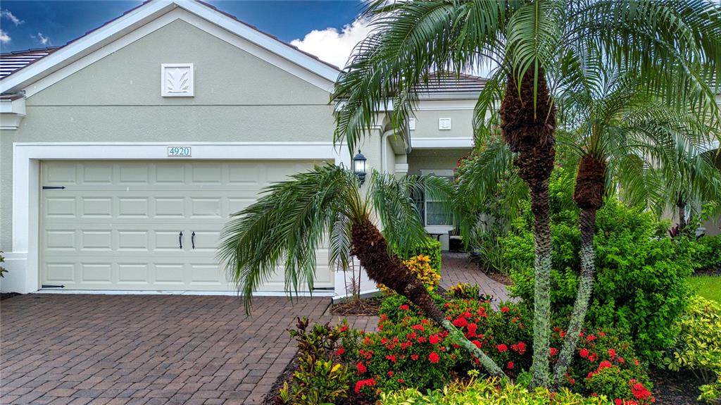 4920 Maymont Park Circle Bradenton, FL 34203 - Photo 10 of 59 a house view with a garden space