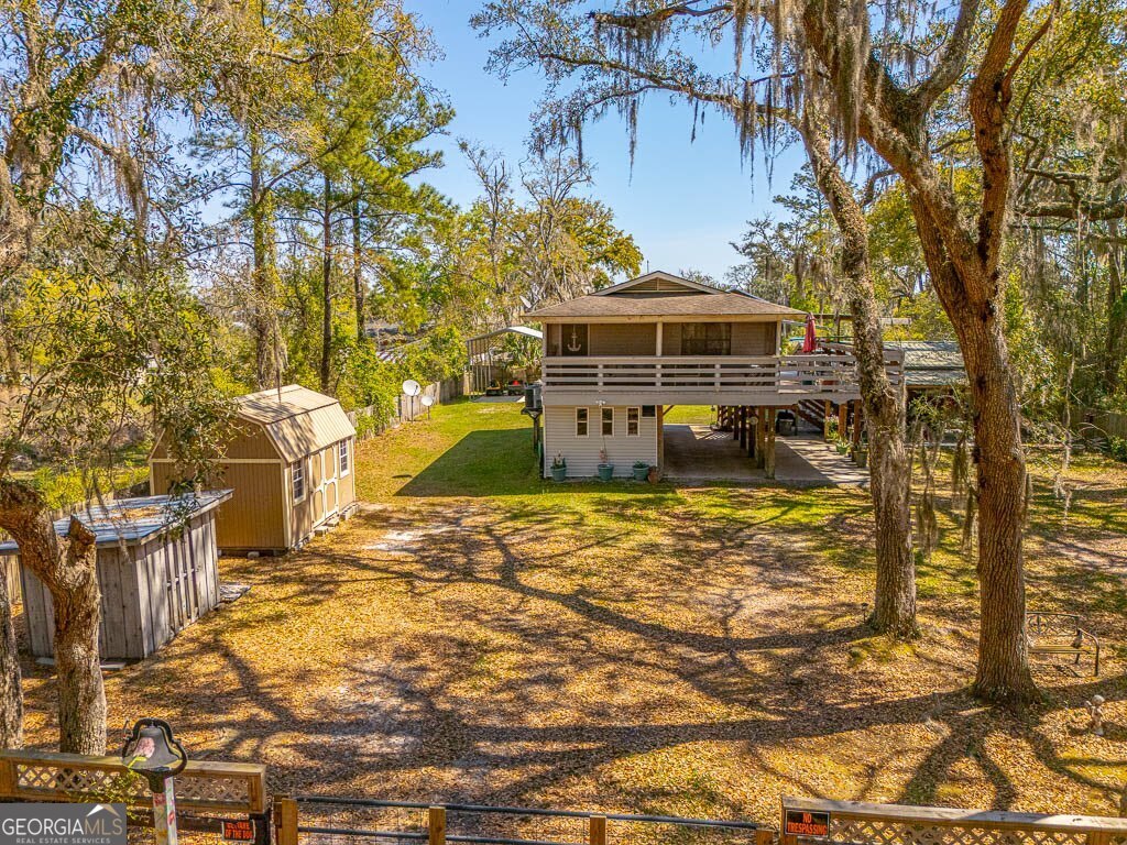 33 Warren Avenue Waverly, GA 31565 - Photo 61 of 63 a view of a yard with plants and large trees