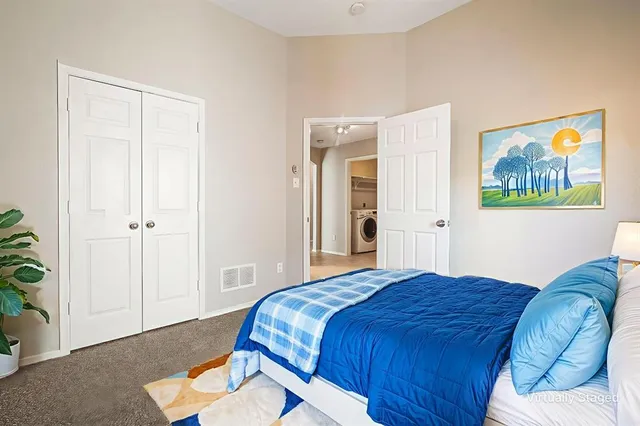 a view of an empty room with a fireplace and a window