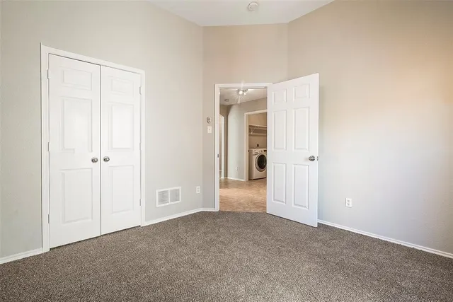 a view of a house with backyard sitting area and swimming pool