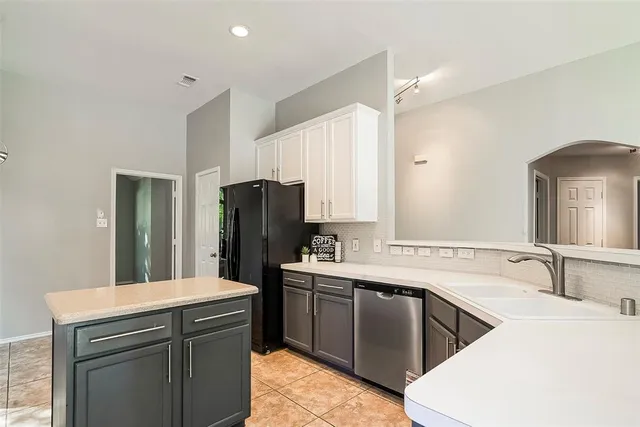 a view of a livingroom with a ceiling fan and window