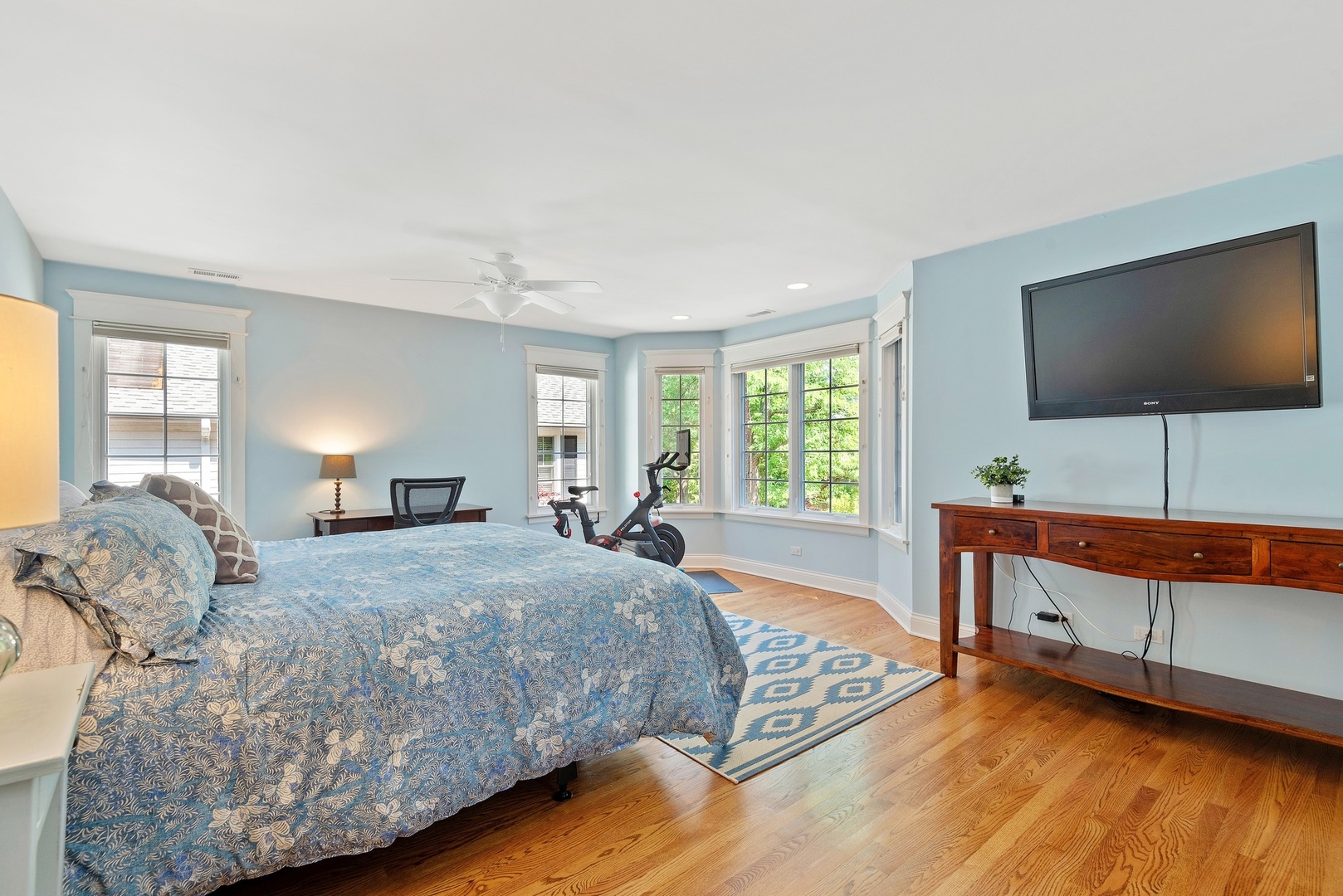 989 Willow Road Winnetka, IL 60093 - Photo 14 of 30 a bedroom with a bed and a flat screen tv