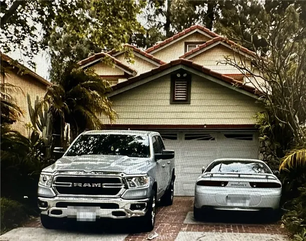 a car parked in front of a house