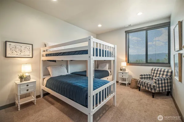 a bedroom with furniture and a window