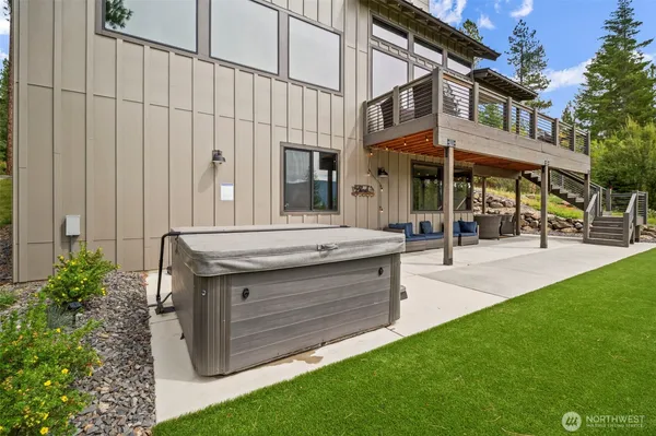 a view of a house with swimming pool and sitting area