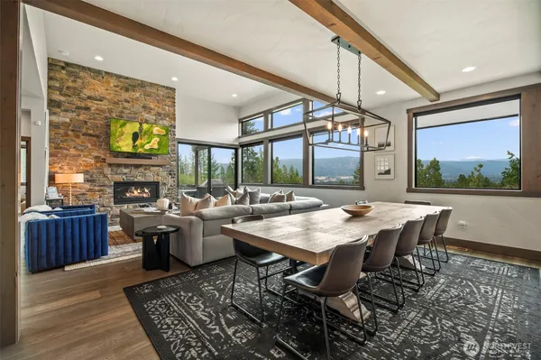 a view of a dining room with furniture window and wooden floor