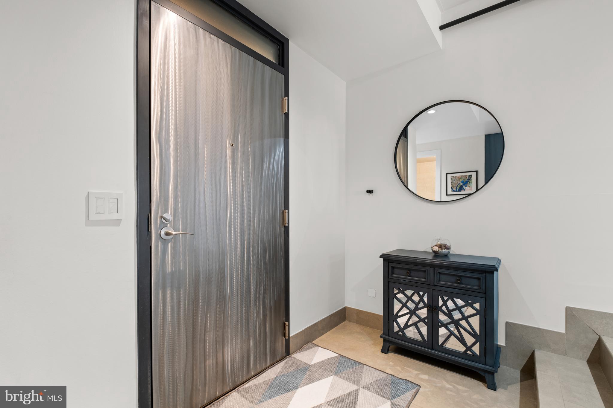 1133 14th Street Northwest, Unit 210 Washington, DC 20005 - Photo 2 of 34 a front view of a house with entryway