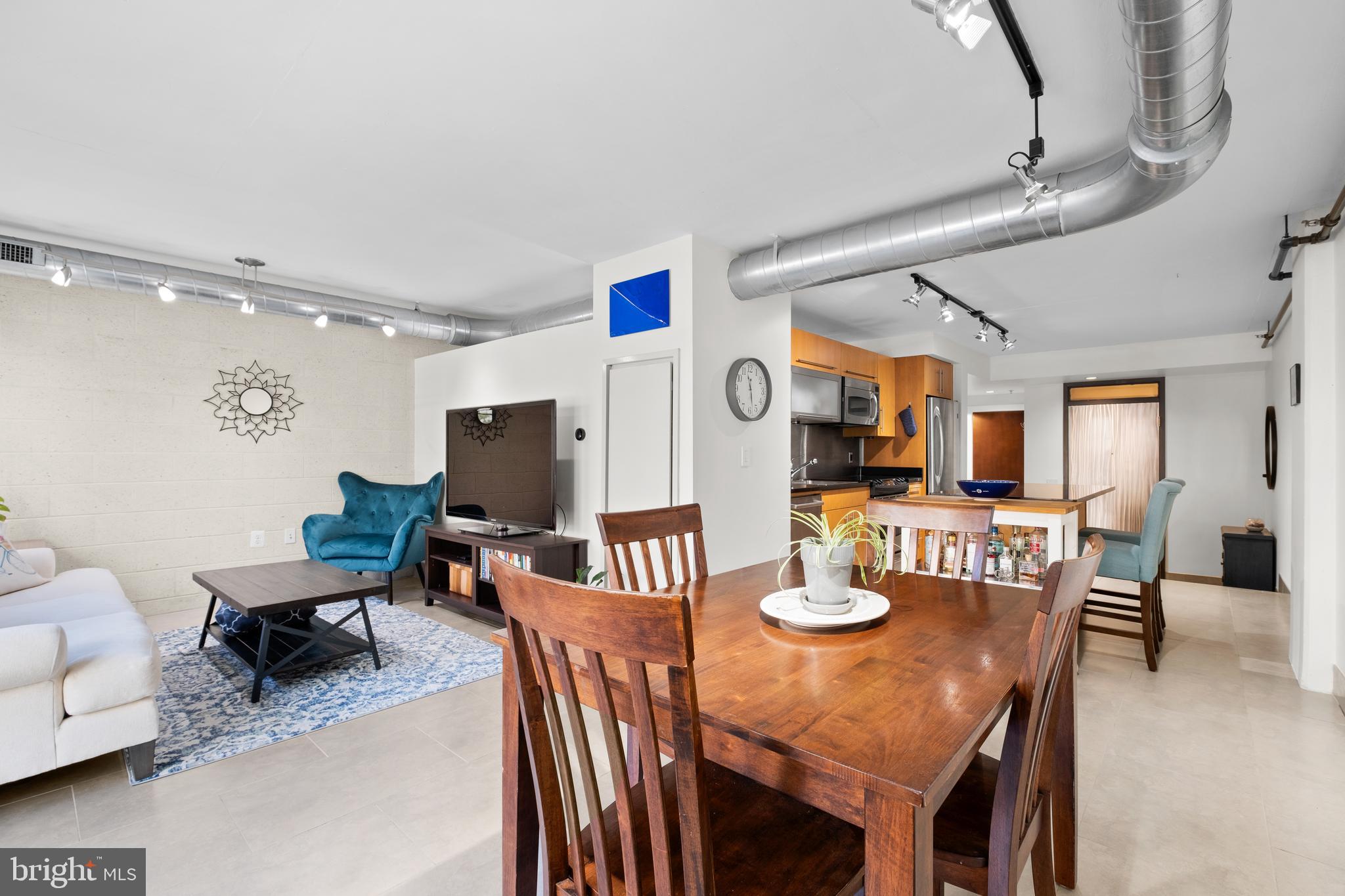 1133 14th Street Northwest, Unit 210 Washington, DC 20005 - Photo 9 of 34 a view of a dining room with furniture