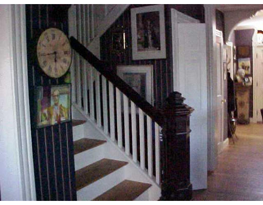 17 Stonecleve Road Wellesley, MA 02482 - Photo 4 of 6 a view of a hallway with wooden floor and entryway
