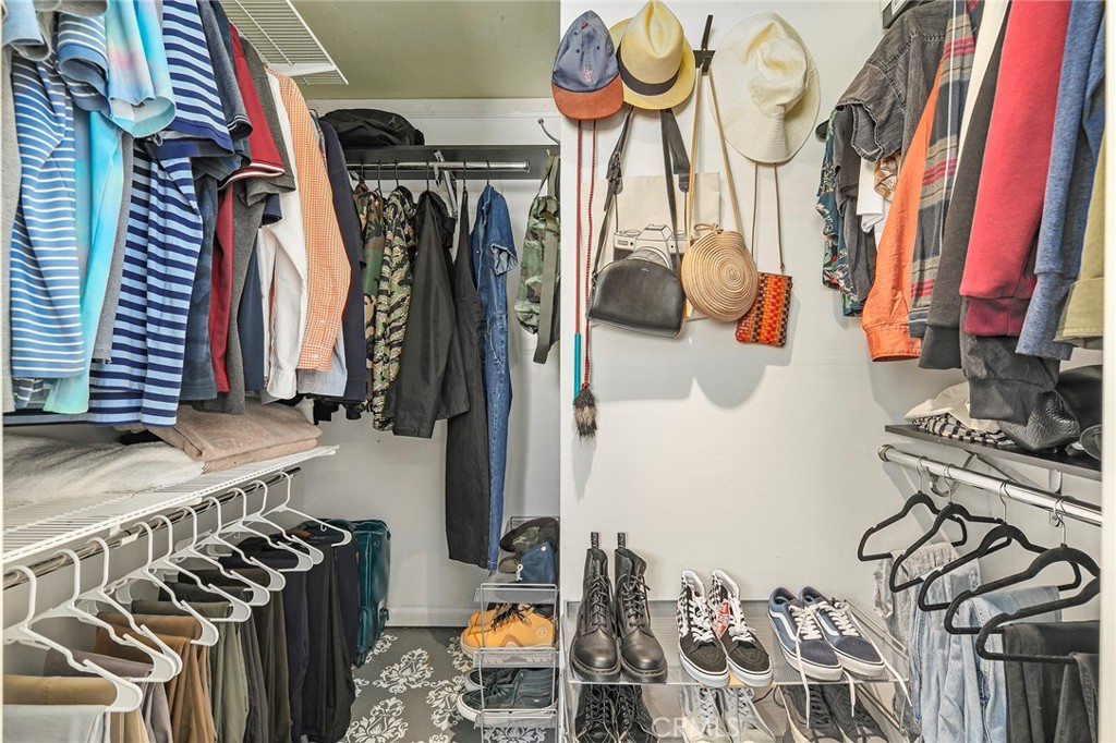2135 East 4th Street, Unit 202 Long Beach, CA 90814 - Photo 11 of 23 a view of walk in closet with clothes and shoes
