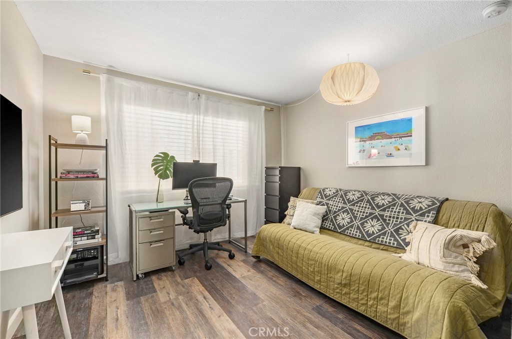 2135 East 4th Street, Unit 202 Long Beach, CA 90814 - Photo 15 of 23 a living room with furniture and a wooden floor