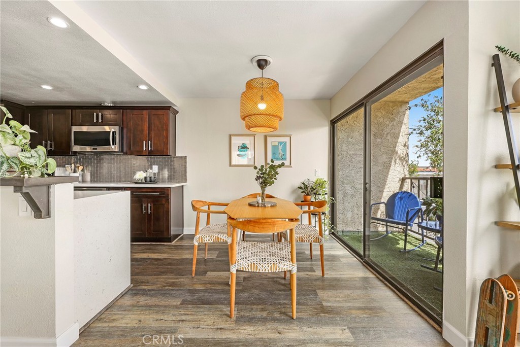 2135 East 4th Street, Unit 202 Long Beach, CA 90814 - Photo 4 of 23 a workspace with furniture window and wooden floor