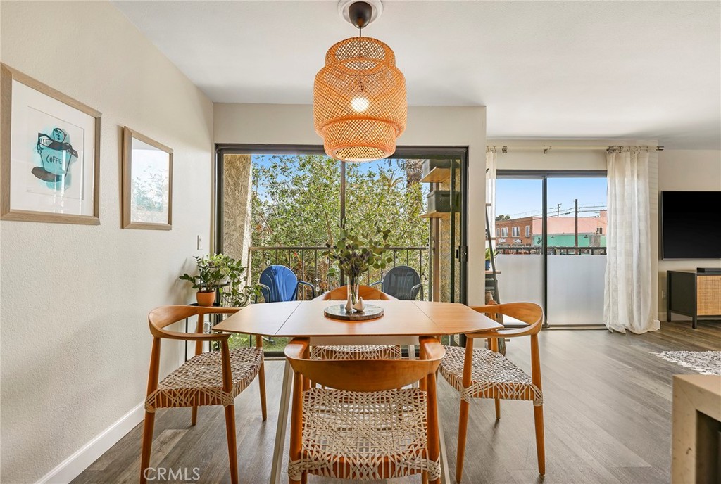 2135 East 4th Street, Unit 202 Long Beach, CA 90814 - Photo 5 of 23 a view of a dining room with furniture window and outside view