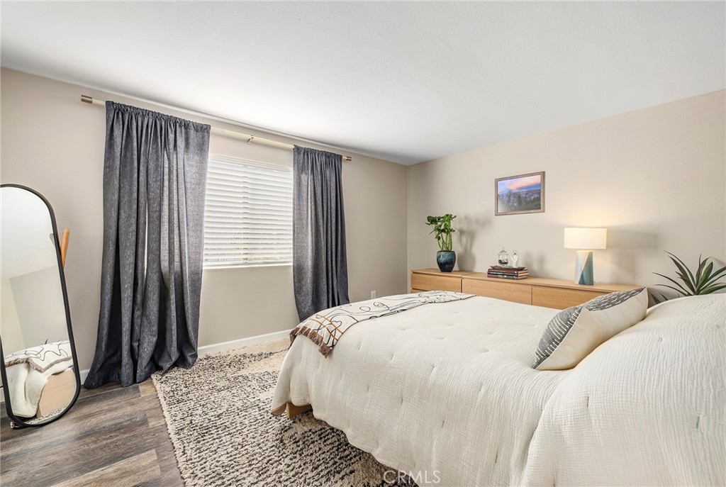 2135 East 4th Street, Unit 202 Long Beach, CA 90814 - Photo 9 of 23 a bedroom with a bed next to a window with the outer view