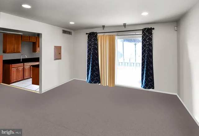 a kitchen with stainless steel appliances a sink stove and refrigerator