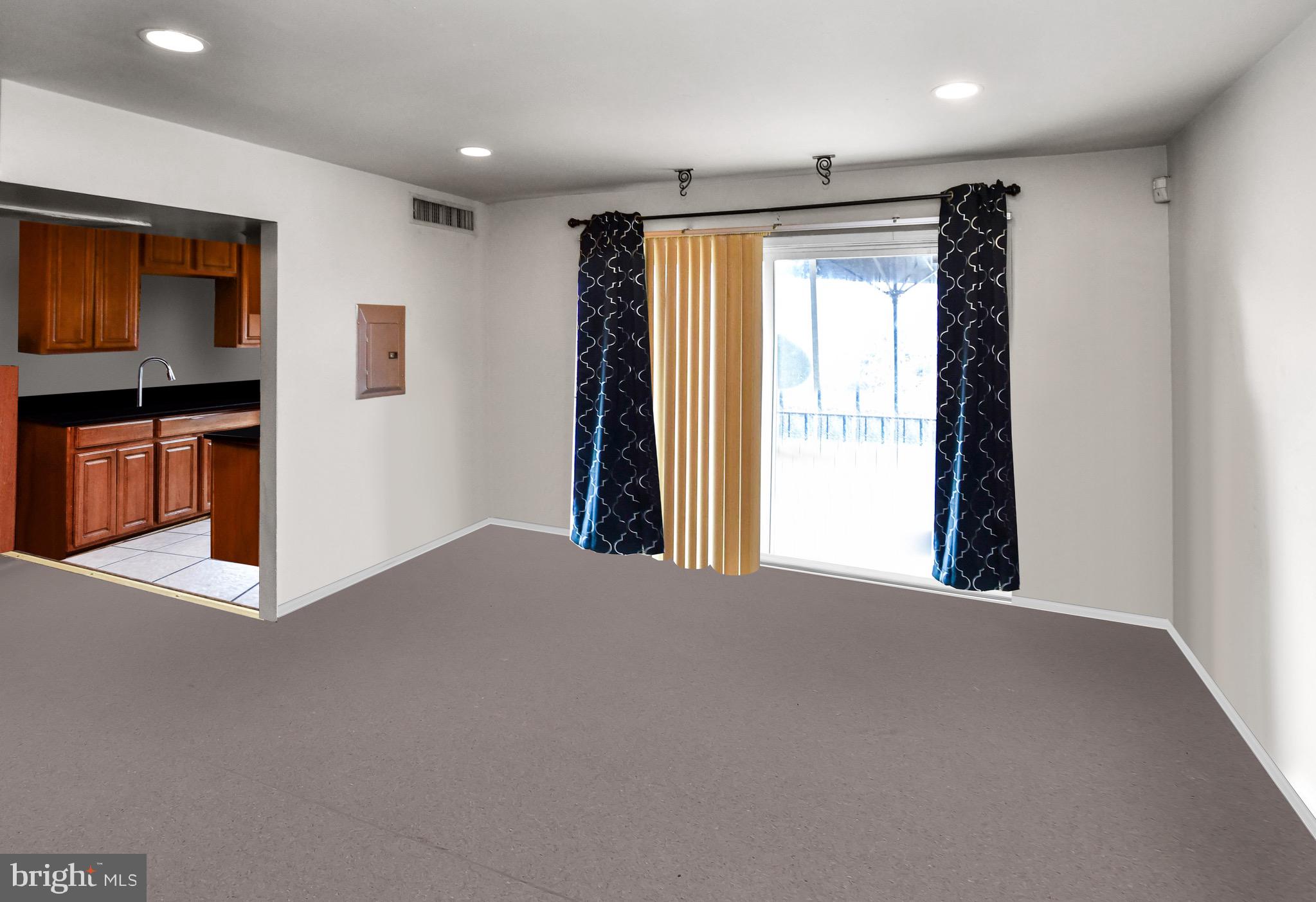 5009 D Street Southeast, Unit 202 Washington, DC 20019 - Photo 4 of 12 a view of an empty room with a window