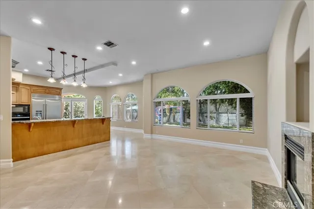 a view of livingroom with furniture and a fireplace