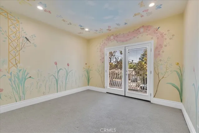 a view of an empty room with empty shelves