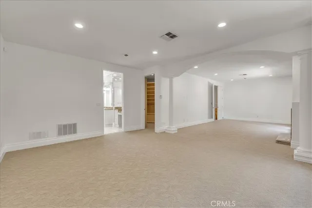 a spacious bathroom with a granite countertop tub sink and mirror