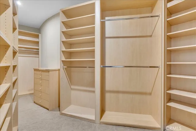 a spacious bathroom with a granite countertop sink mirror and a