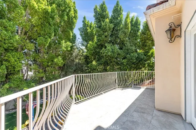 an empty room with windows and cabinet