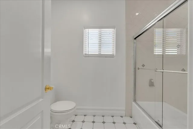 a front view of a house with patio furniture