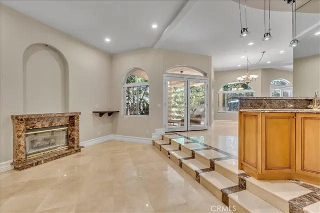 a view of a room with gym equipment and large mirror