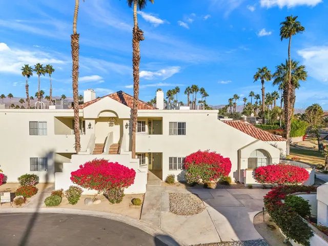 a living room with furniture fireplace and a flat screen tv