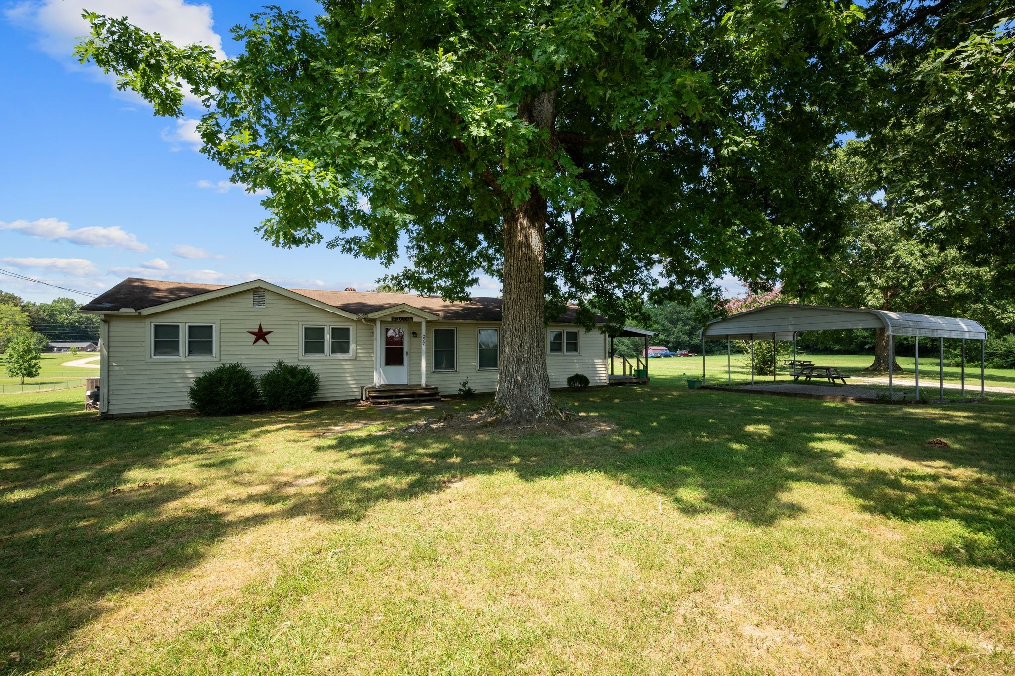 227 Pleasant View Road White Bluff, TN 37187 - Photo 13 of 19 a front view of a house with a yard