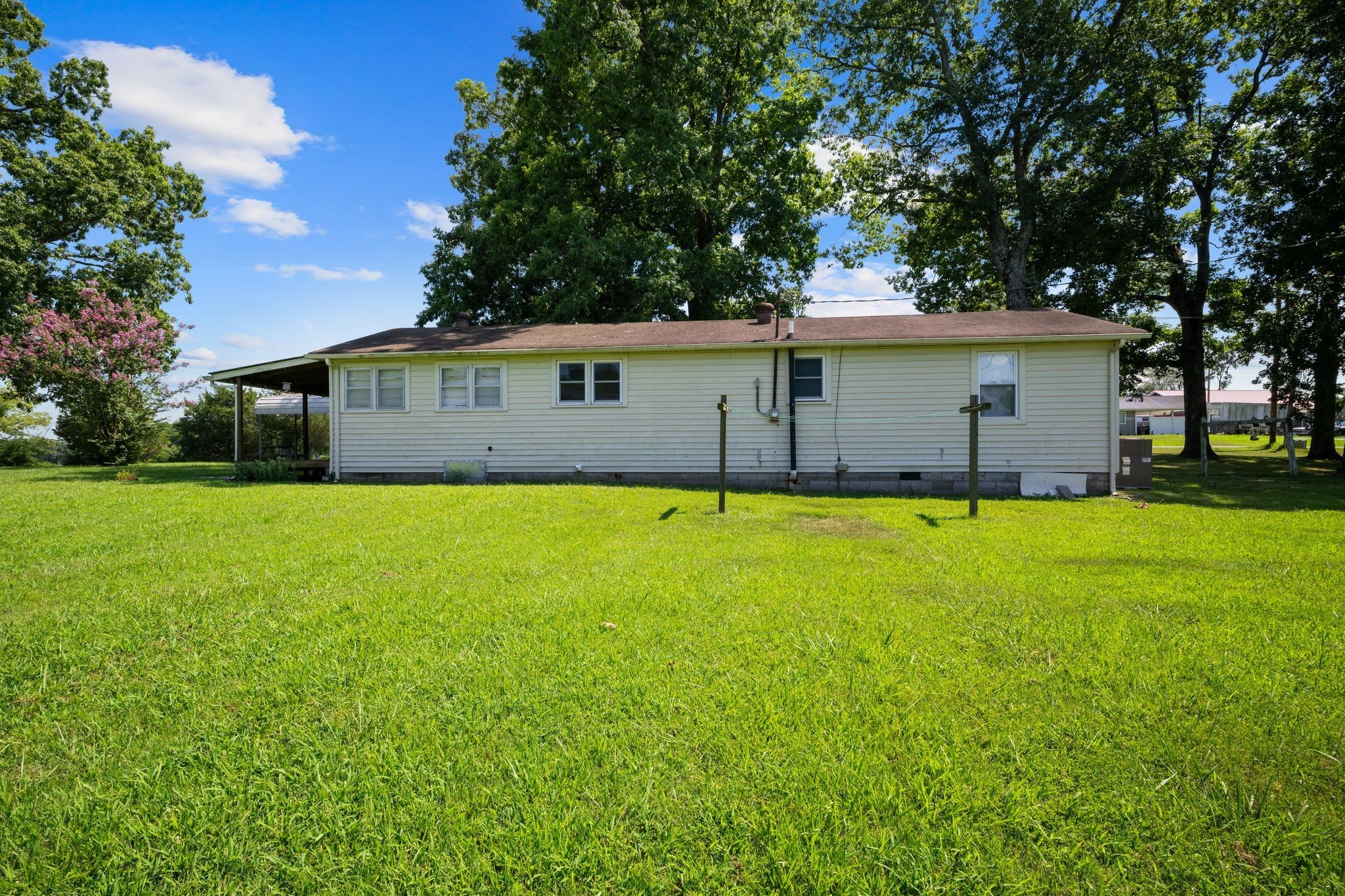 227 Pleasant View Road White Bluff, TN 37187 - Photo 14 of 19 a view of a house with a backyard