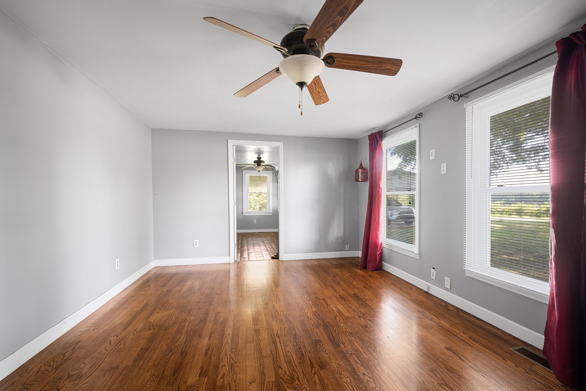 227 Pleasant View Road White Bluff, TN 37187 - Photo 3 of 19 wooden floor in an empty room with a window