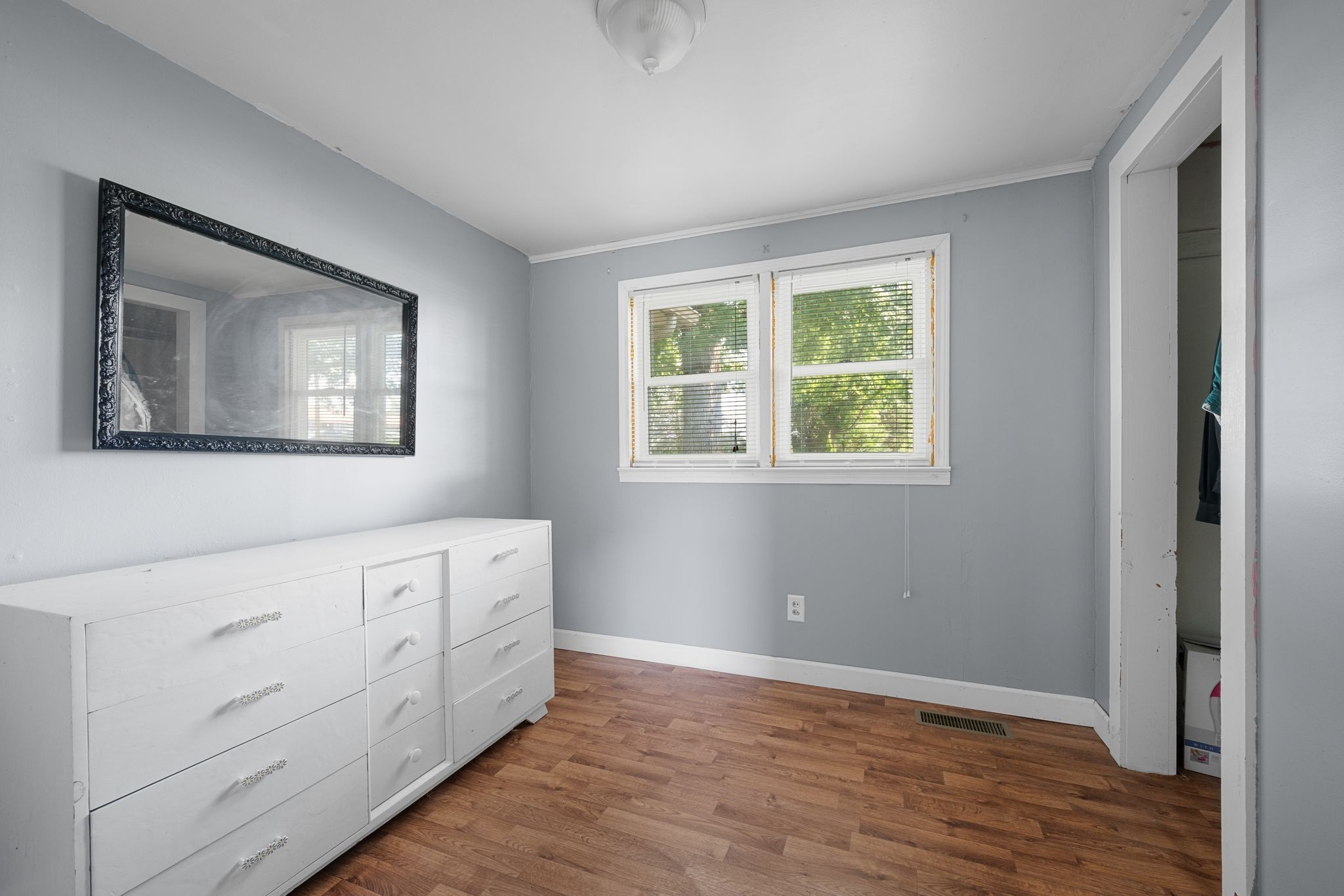 227 Pleasant View Road White Bluff, TN 37187 - Photo 9 of 19 a view of an empty room with wooden floor and a window