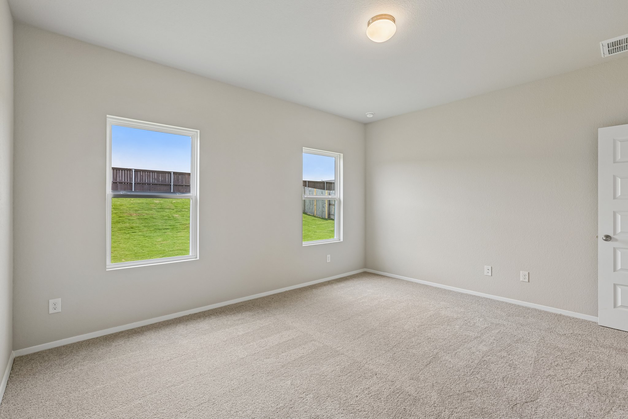 5513 Sacra Cove Austin, TX 78747 - Photo 17 of 37 a view of an empty room with a window and a window