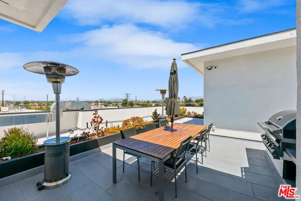 a view of a terrace with furniture