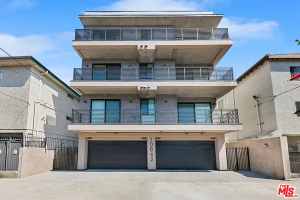 a view of a building with a garage