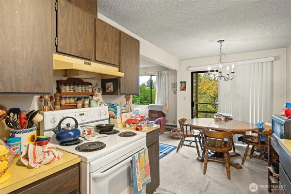 a view of a kitchen tables and a dining table chairs