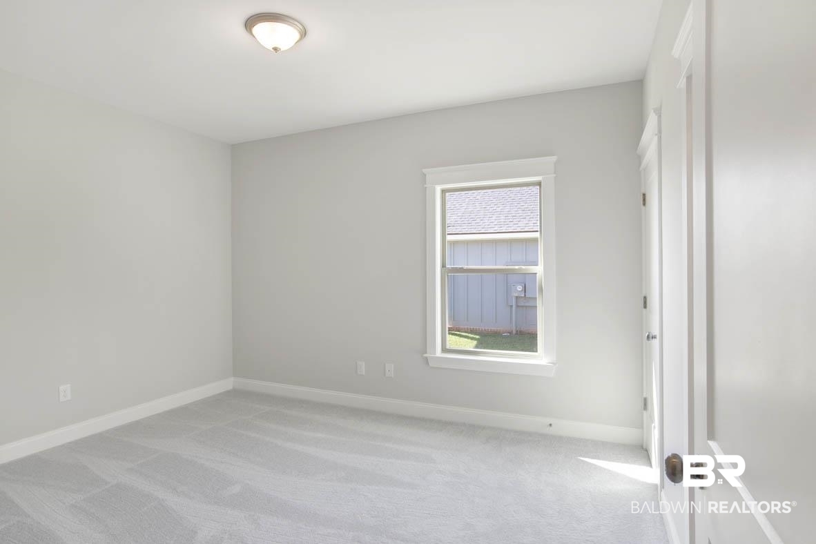 393 Garrison Boulevard Fairhope, AL 36532 - Photo 22 of 40 Empty room featuring light carpet