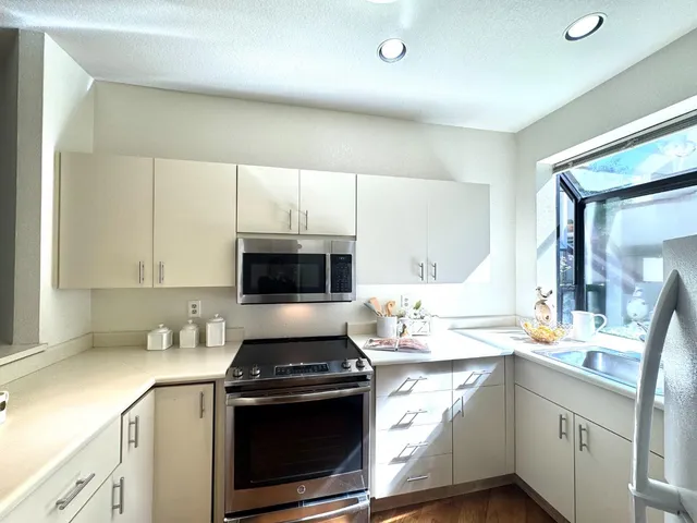 a bedroom with a bed and glass door