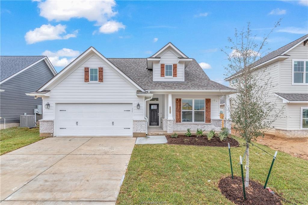 3165 Tarleton Court Bryan, TX 77808 - Photo 1 of 1 a front view of a house with a yard