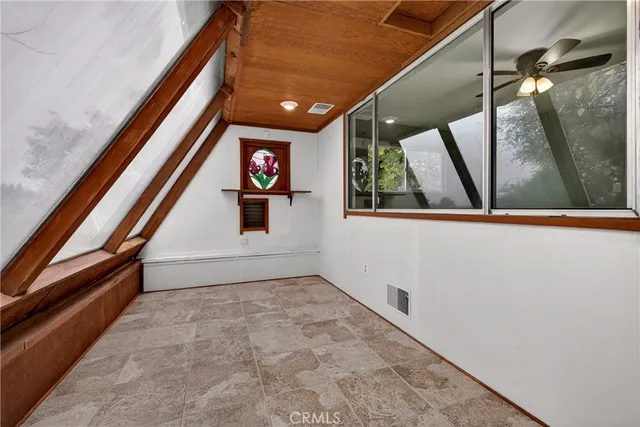 a view of a kitchen with a sink and a large window