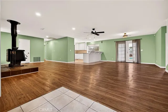 a view of an entryway with wooden floor
