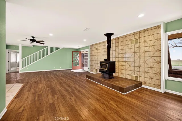 a view of a kitchen with refrigerator and cabinet