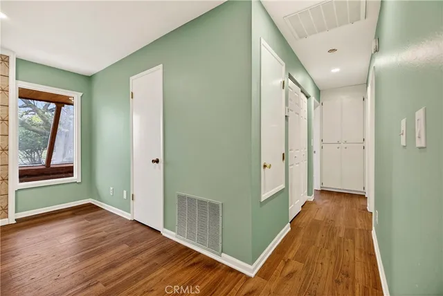 a view of room with window and ceiling fan