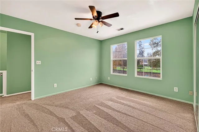 a view of a house with a backyard and a slide