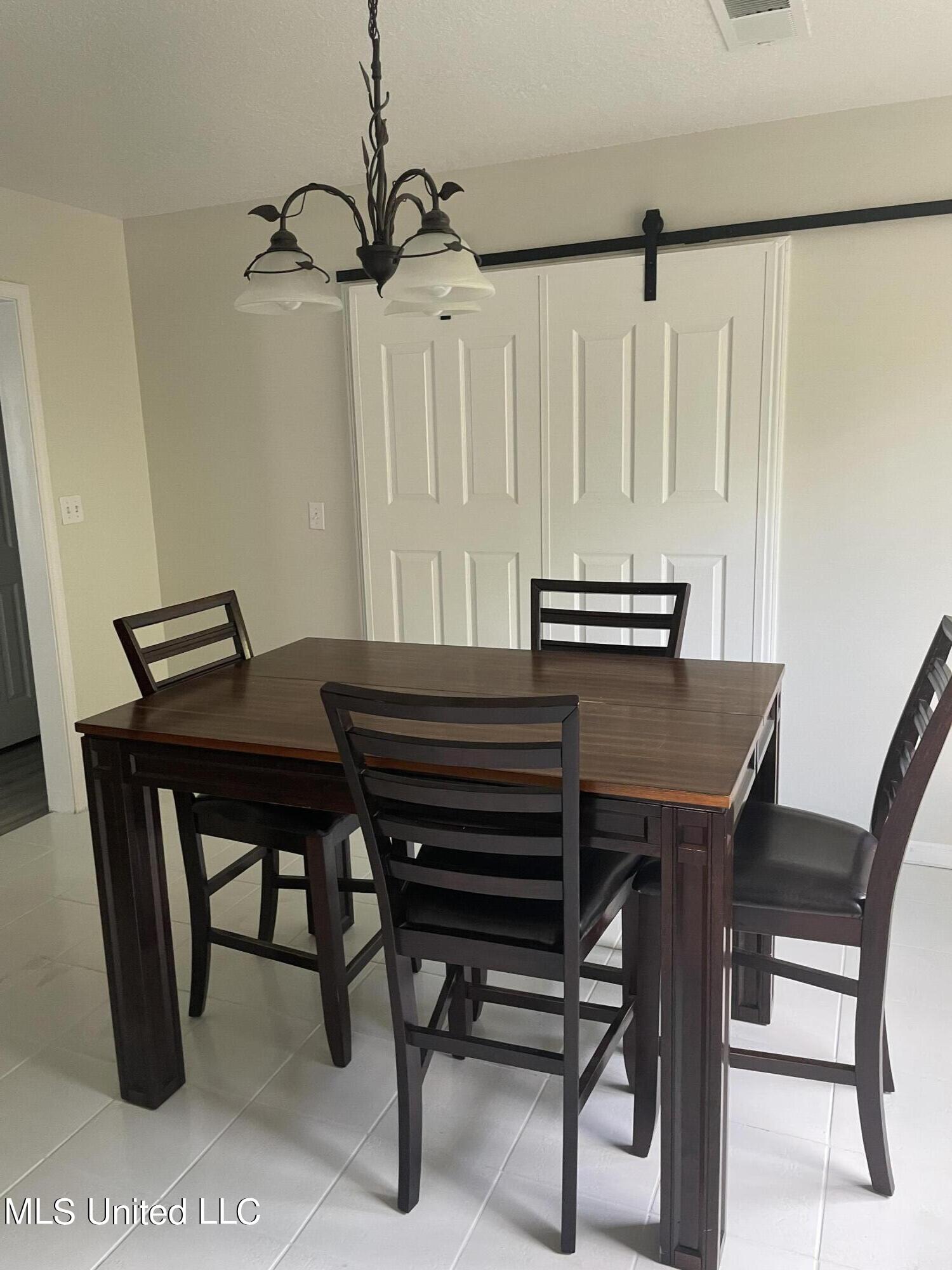 16116 Race Track Road Biloxi, MS 39532 - Photo 15 of 25 Front Pic of Barn Door in Dining Room on