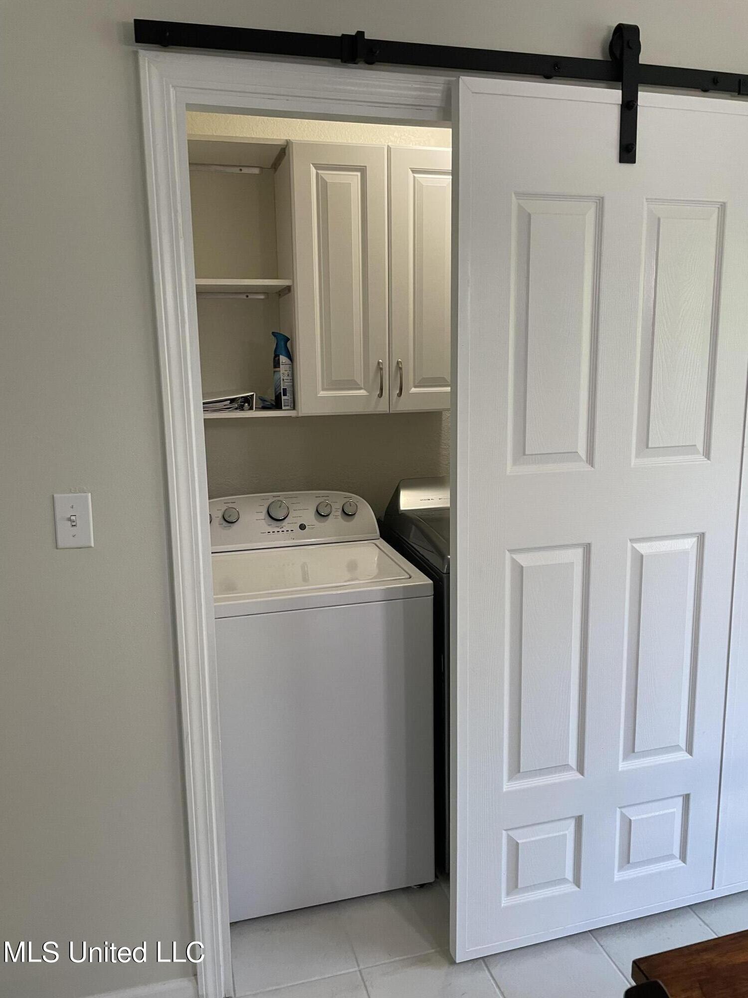 16116 Race Track Road Biloxi, MS 39532 - Photo 16 of 25 Barn Door to Laundry on Racetrack