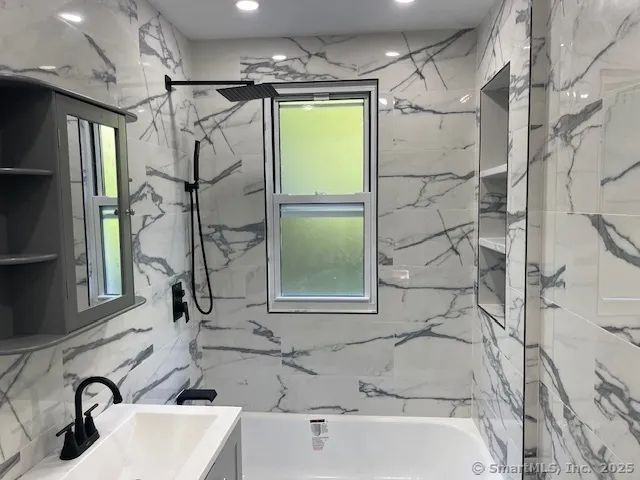 a bathroom with a sink and a bathtub