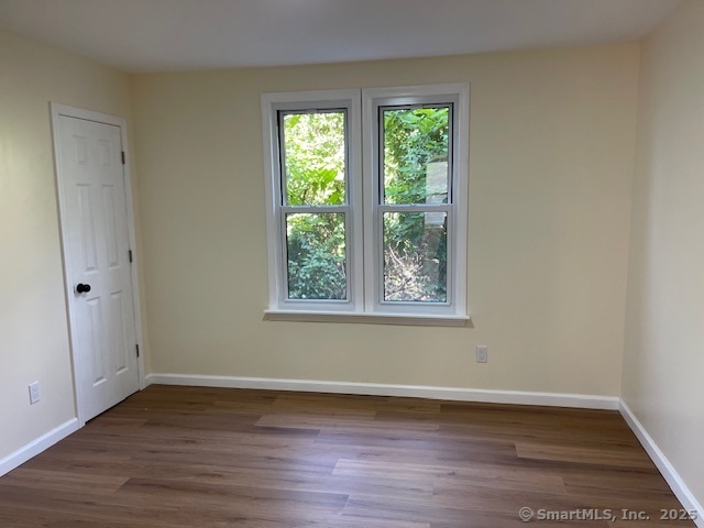 280 Meriden Road Waterbury, CT 06705 - Photo 18 of 27 a view of a room with wooden floor and window