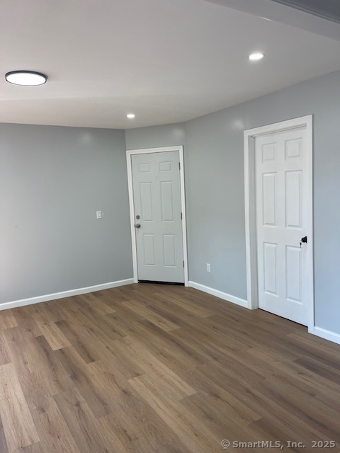 280 Meriden Road Waterbury, CT 06705 - Photo 8 of 27 a view of an empty room with wooden floor